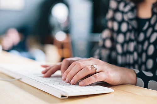 person typing on a keyboard